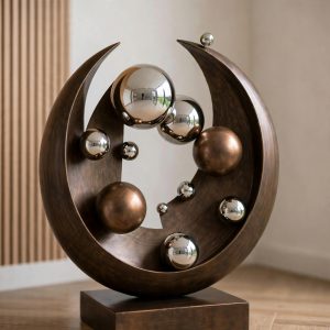 bronze cirular large sculpture with silver spheres